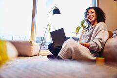 Woman sitting at a desk working on marketing platform.