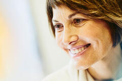 A woman smiling