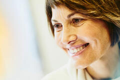 A woman smiling