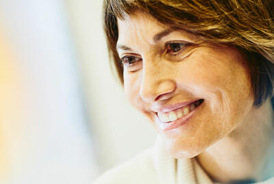 A woman smiling